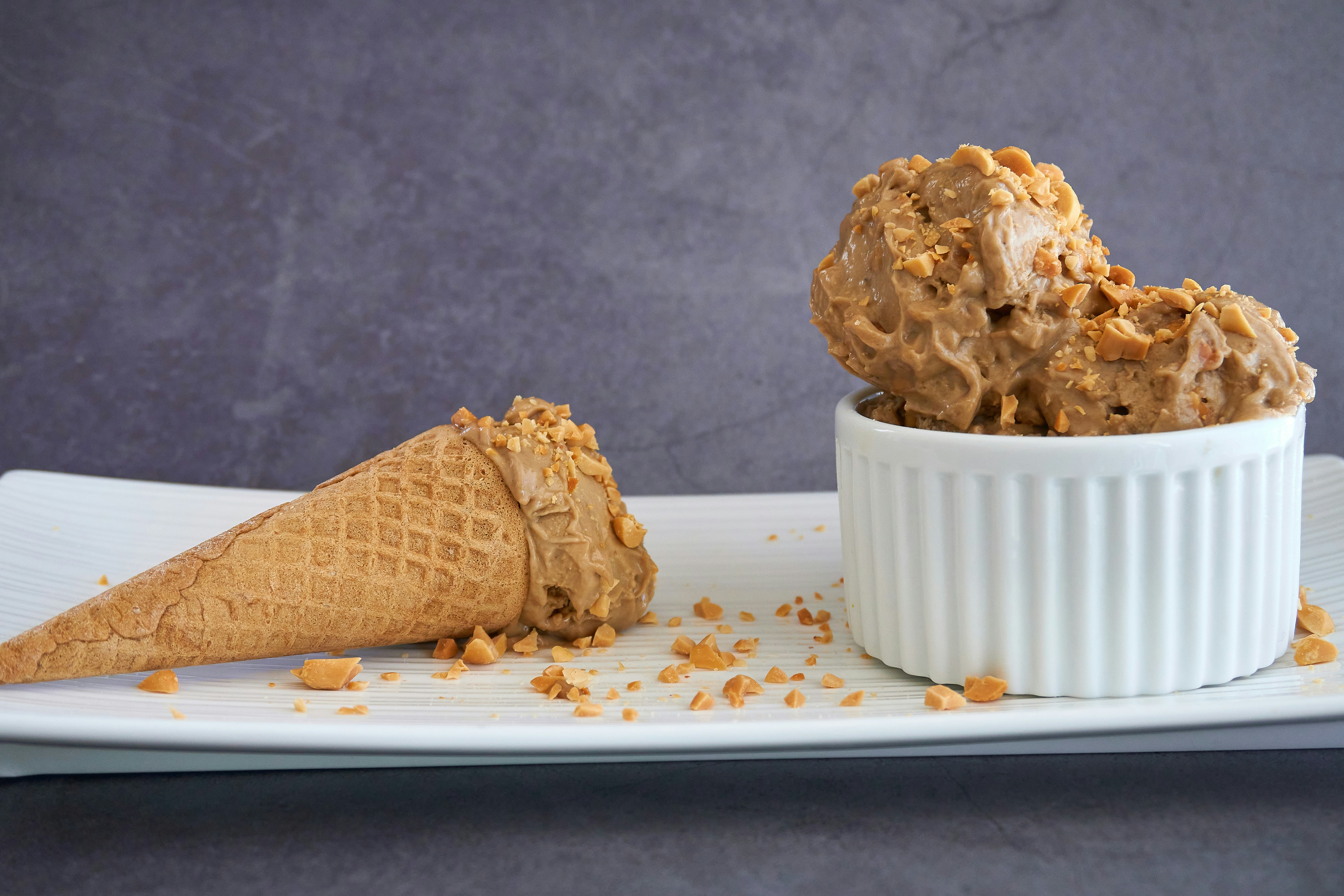 brown ice cream cone on white ceramic plate