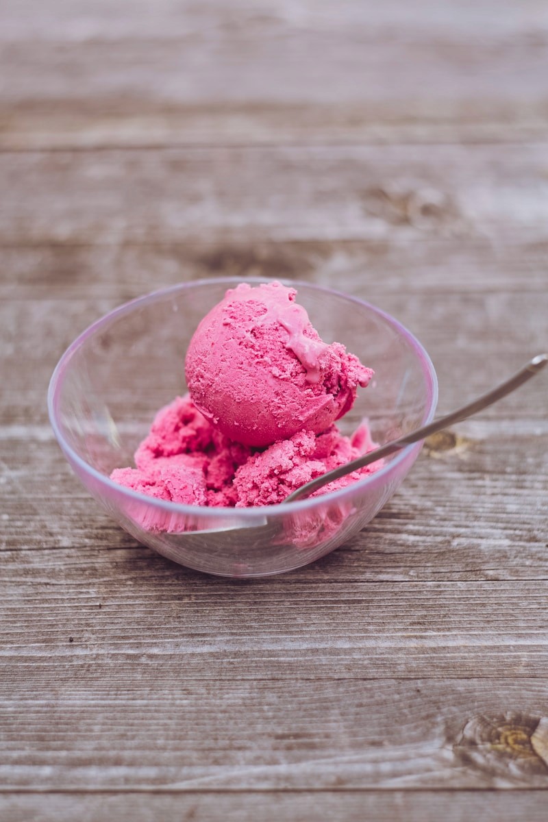 Strawberry gelato in a glass bowl